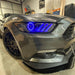 Close up of blue headlight halos and DRLs installed on a Ford Mustang headlights.