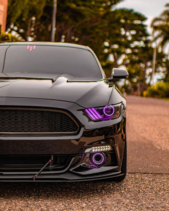 Front end of a Ford Mustang with purple headlight halos and DRLs.