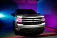 Silver chevy silverado with pink DRL and projectors