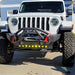Front end of a white Jeep with LED Integrated Skid Plate installed.