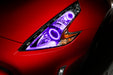 Nissan 370Z headlights with purple LED halo rings installed.