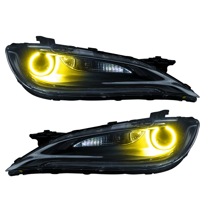 Chrysler 200 headlights with yellow LED halo rings.