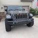 Front end of a Jeep Gladiator JT with amber Pre-Runner Style LED Grill Light Kit installed.