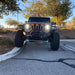 Front view of a Jeep Gladiator JT with amber Pre-Runner Style LED Grill Light Kit installed.
