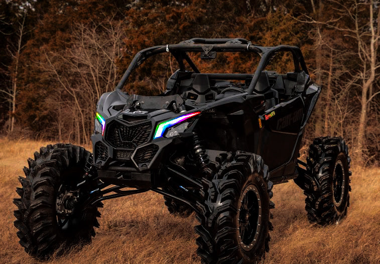Three quarters view of a Can-Am Maverick X3 with Dynamic ColorSHIFT DRLs.