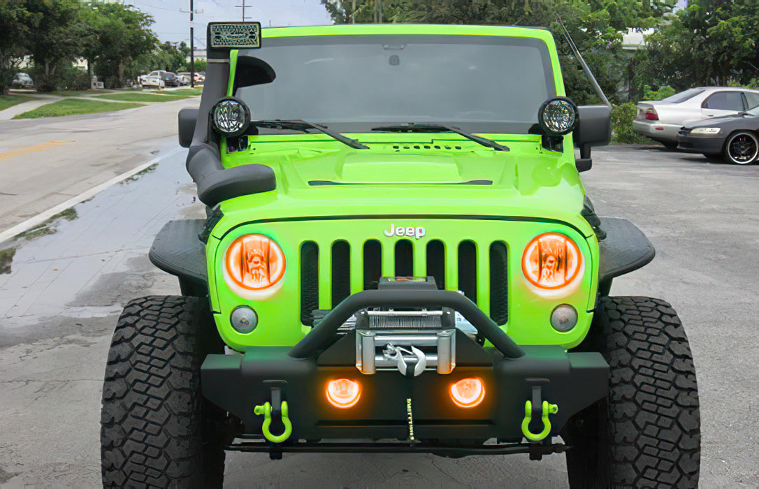 Front end of a Jeep Wrangler with amber LED headlight and fog light halos installed.