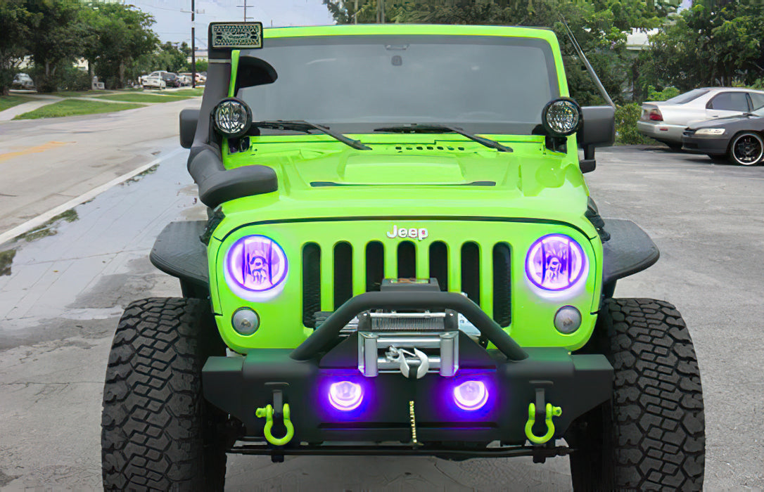 Front end of a Jeep Wrangler with purple LED headlight and fog light halos installed.