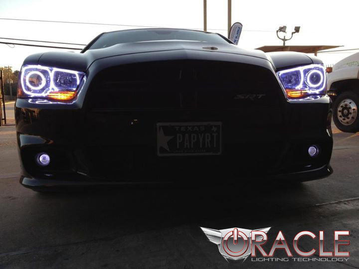 Front end of a Dodge Charger with white LED headlight halo rings installed.