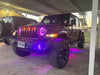 Three quarters view of a Jeep Wrangler JL, with ColorSHIFT Oculus Headlights installed.