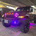 Three quarters view of a Jeep Wrangler JL with amber Pre-Runner Style LED Grill Light Kit installed.