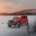 Three quarters view of a red Jeep Wrangler JL with amber Pre-Runner Style LED Grill Light Kit installed.