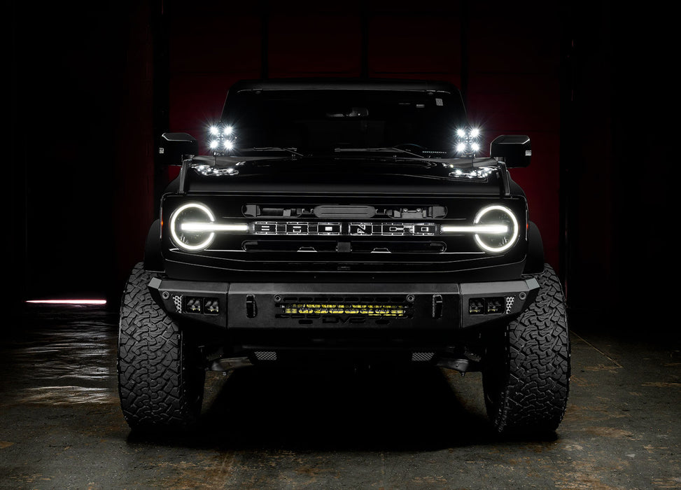 Front view of a black Ford Bronco with 2 7" Multifunction LED Spotlights installed on the dash.