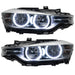 BMW 320 headlights with white LED halo rings.
