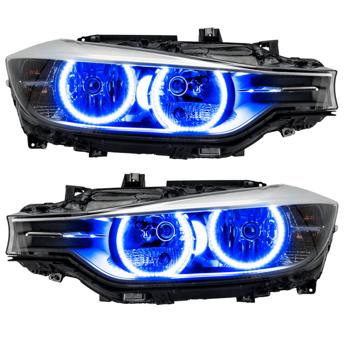 BMW 320 headlights with blue LED halo rings.