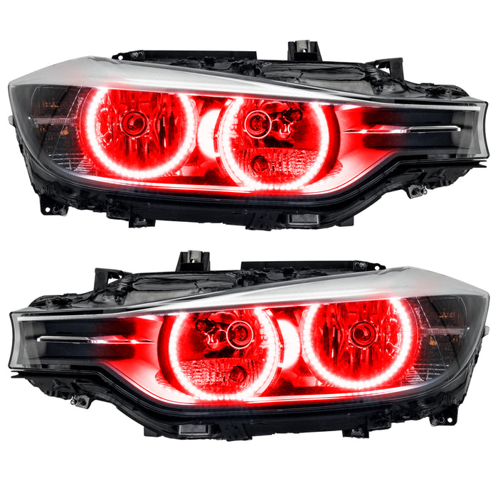 BMW 320 headlights with red LED halo rings.