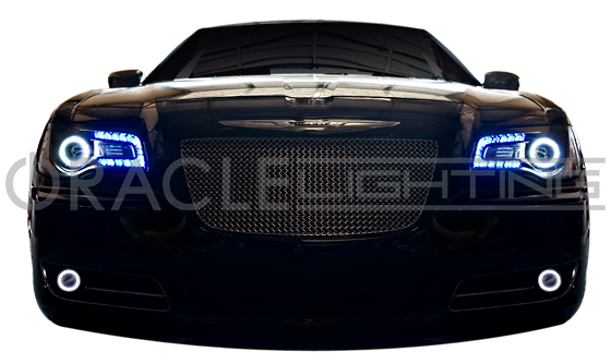 Front end of a Chrysler with white LED headlight and fog light halo rings installed.