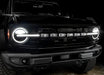 Close-up on the front end of a Ford Bronco with Universal Illuminated LED Letter Badges installed.