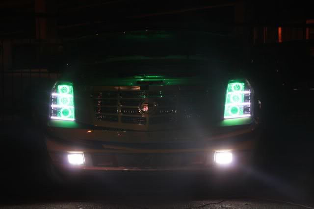 Front end of a Cadillac Escalade with white LED headlight and fog light halo rings installed.