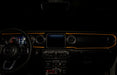 View of a Jeep dashboard from the backseat, with amber fiber optic lighting installed.