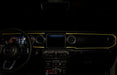 View of a Jeep dashboard from the backseat, with yellow fiber optic lighting installed.