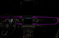 View of a Jeep dashboard from the backseat, with pink fiber optic lighting installed.