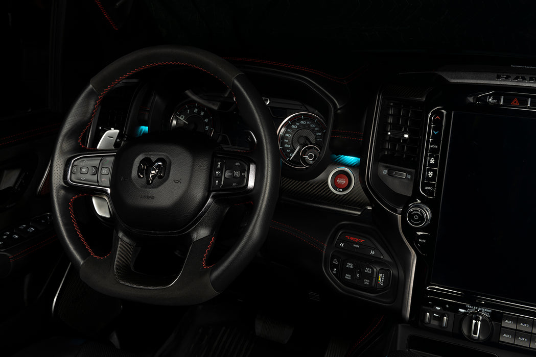 Drivers side seat of a RAM TRX with cyan LED ambient lighting.
