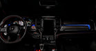 View of a RAM TRX dashboard from the backseat with blue LED ambient lighting kit.