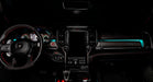 View of a RAM TRX dashboard from the backseat with cyan LED ambient lighting kit.
