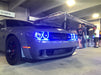 Challenger parked in parking garage with blue halo headlights