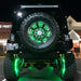 Rear view of a Jeep with green LED Illuminated Spare Tire Wheel Ring Third Brake Light installed.