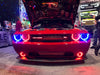 Front end of a Dodge Challenger with red LED fog light halo rings.