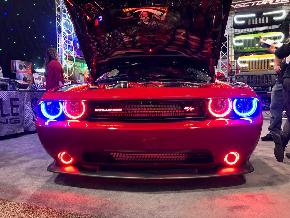 Red challenger in showroom with blue and red halos