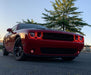 Red challenger with red headlight and fog light halos