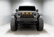 Front end of a Jeep with Oculus Headlights installed, with white LED halos.