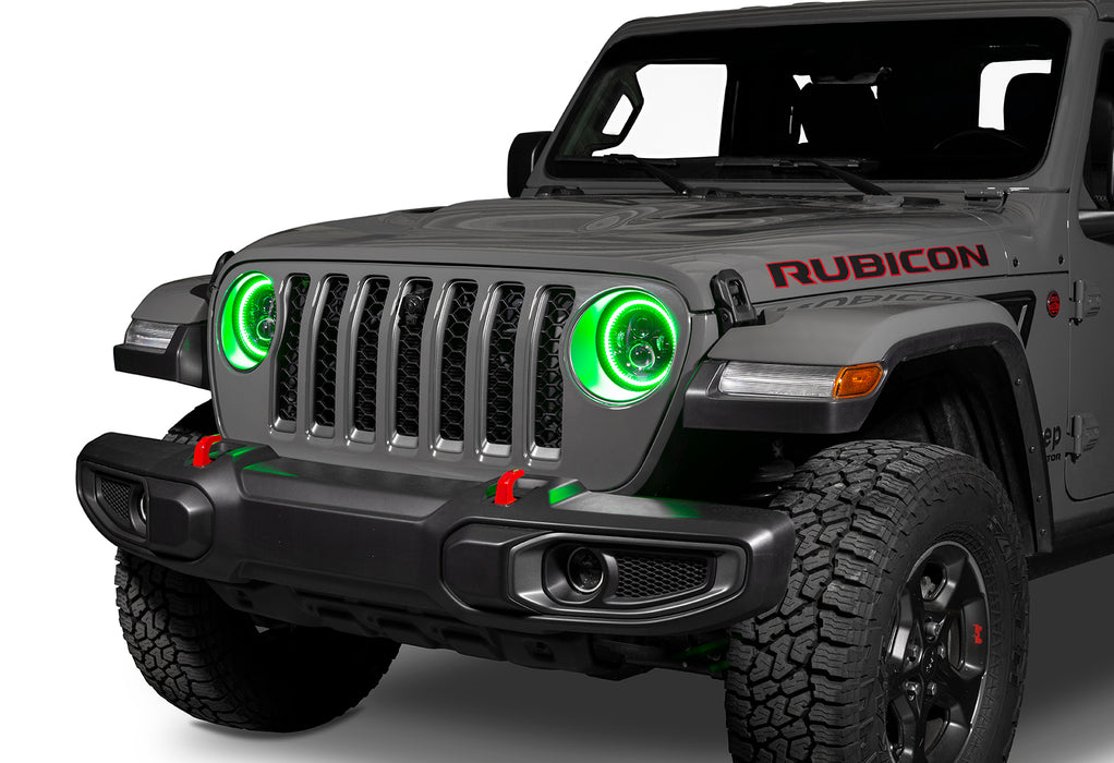 Front end of a Jeep with 7" High Powered LED Headlights installed with green halos on.