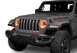 Front end of a Jeep with 7" High Powered LED Headlights installed with amber halos on.