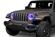 Front end of a Jeep with 7" High Powered LED Headlights installed with purple halos on.