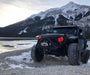 Three quarters view of a Jeep Wrangler with 7" High Powered LED Headlights and red LED halo rings on.
