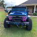 Front end of Jeep Wrangler with purple Vector™ Series Grill LED Halo Kit