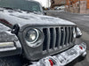 Close-up of oculus heated lens installed on snowy jeep