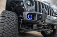 Close-up on the front bumper of a Jeep with High Performance 20W LED Fog Lights installed, and blue halos on.