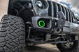 Close up on the front bumper of a Jeep with High Performance 20W LED Fog Lights installed, and green halos on.