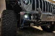 Close-up on the front bumper of a Jeep, with High Performance 20W LED Fog Lights installed.