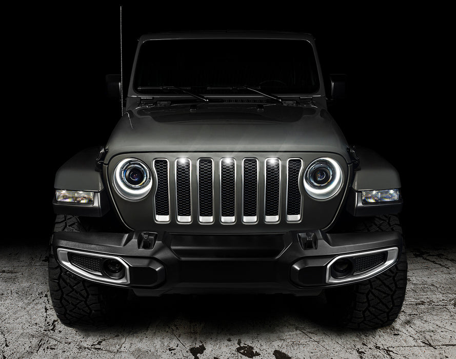 Front end of a Jeep Wrangler with white LED Grill Light Kit installed.