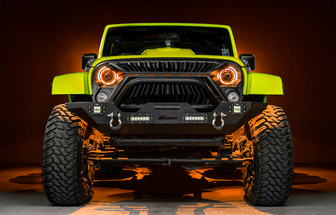Front view of a yellow Jeep with 7" Oculus Headlights installed, set to amber LEDs.