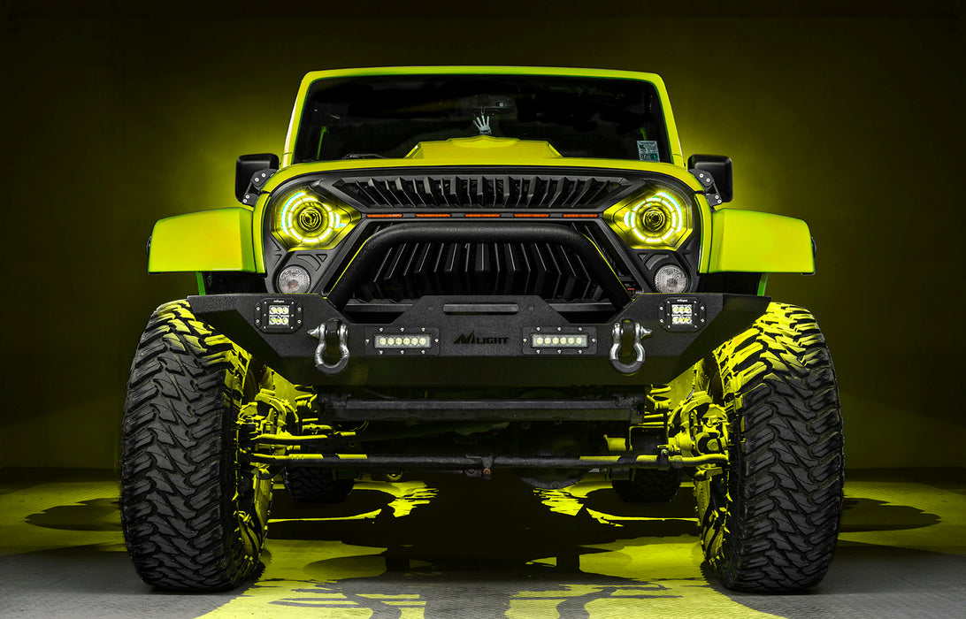 Front view of a yellow Jeep with 7" Oculus Headlights installed, set to yellow LEDs.