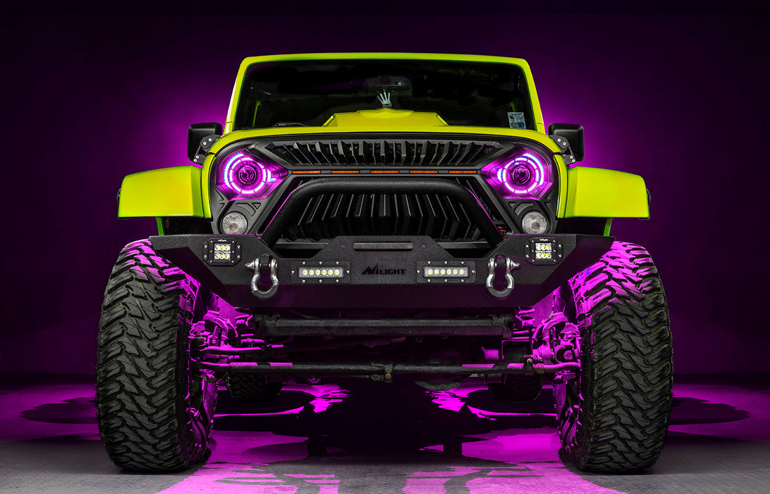 Front view of a yellow Jeep with 7" Oculus Headlights installed, set to pink LEDs.