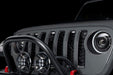 Close-up of a Universal Pre-Runner Style LED Grill Light Kit with clear lens installed on Jeep Wrangler.