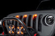 Close-up of Universal Pre-Runner Style LED Grill Light Kit installed on a Jeep Wrangler with amber LEDs.