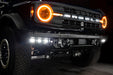 Front end of a Ford Bronco with multiple ORACLE Lighting products installed, including ColorSHIFT Halo Headlights and Triple Fog Lights.